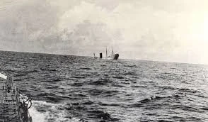 On July 17, 1918, this historic photograph captures the final moments of the Carpathia as it plunged into the ocean after being torpedoed by a German U-boat taken from an escaping lifeboat.